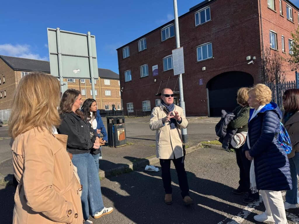 Amplify Peace group participating in a guided community learning tour through East Belfast