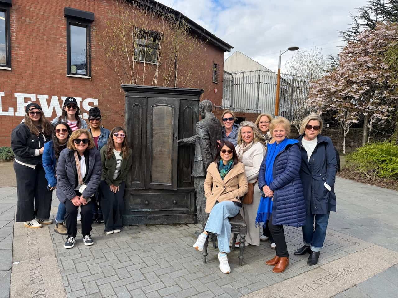 Amplify Peace group at CS Lewis Square in Belfast beside a Narnia-inspired sculpture